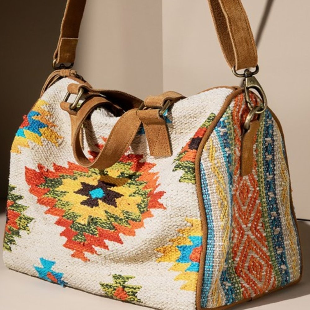 Woven Harlow Boston Bag with genuine suede handle and tassel.